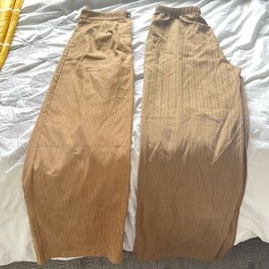 2 wide legged pants. One button and one stretchy.